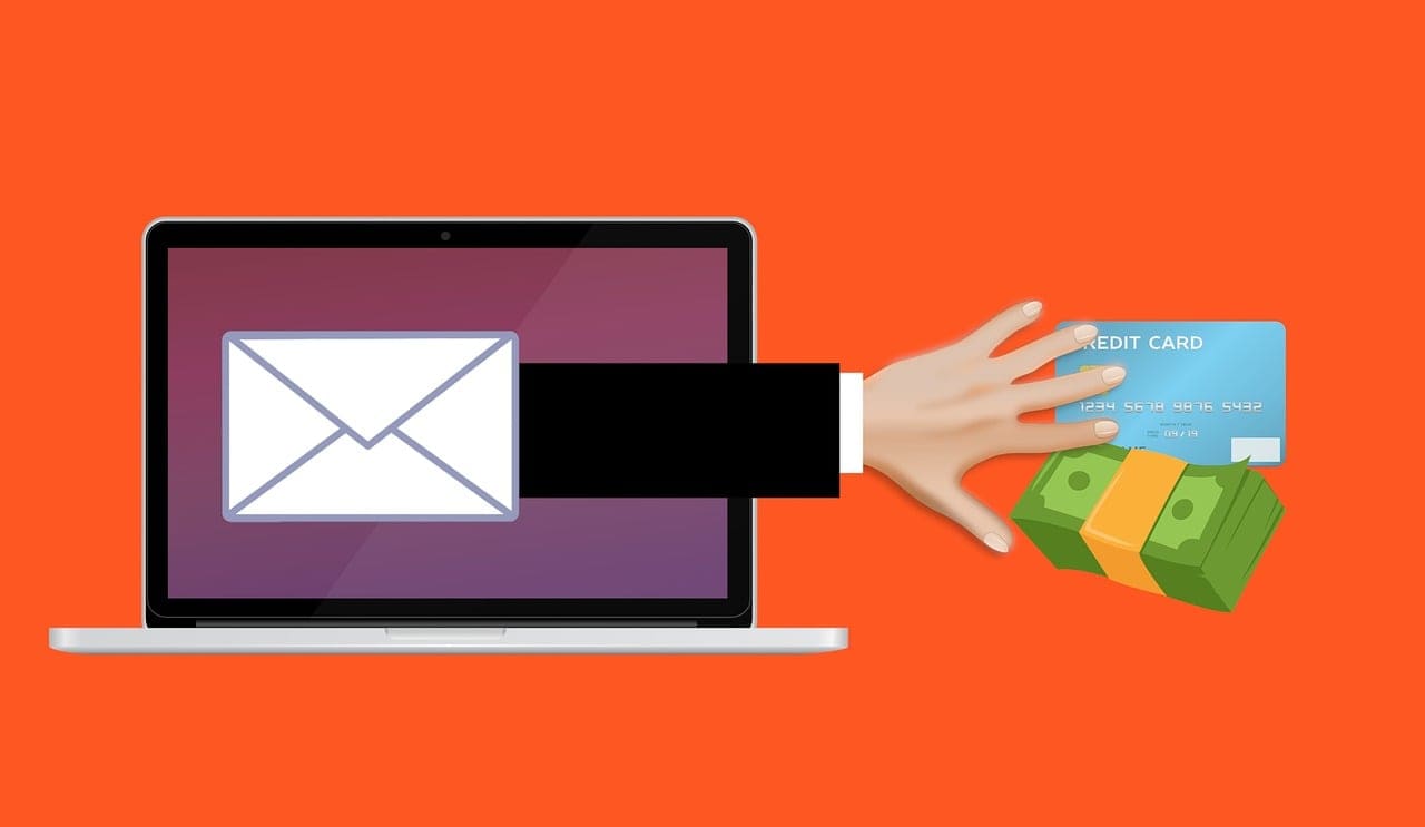 A padlock icon over a laptop keyboard, representing a phishing or email scam attack