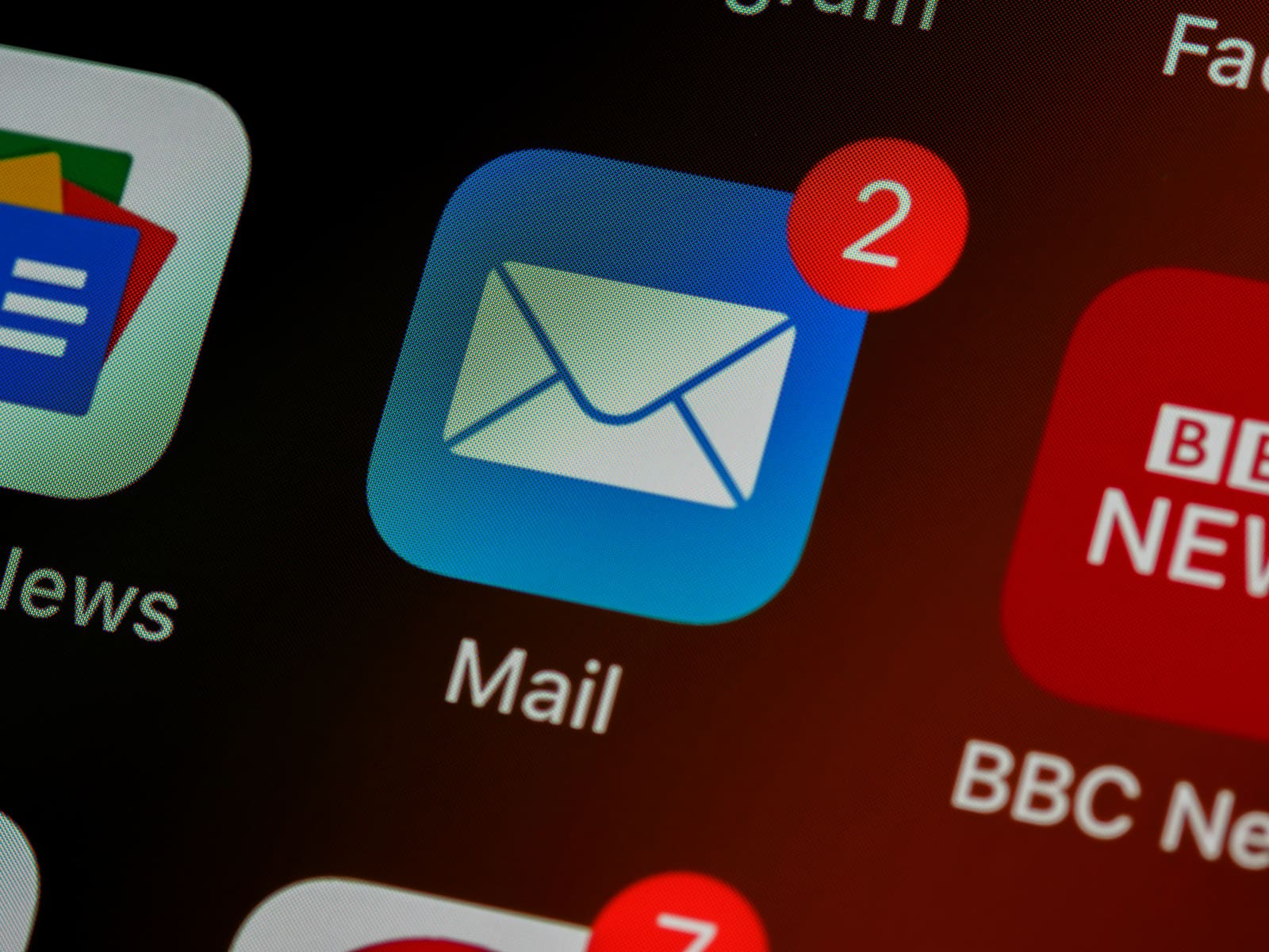 A close-up of a phone screen showing the Mail app icon
