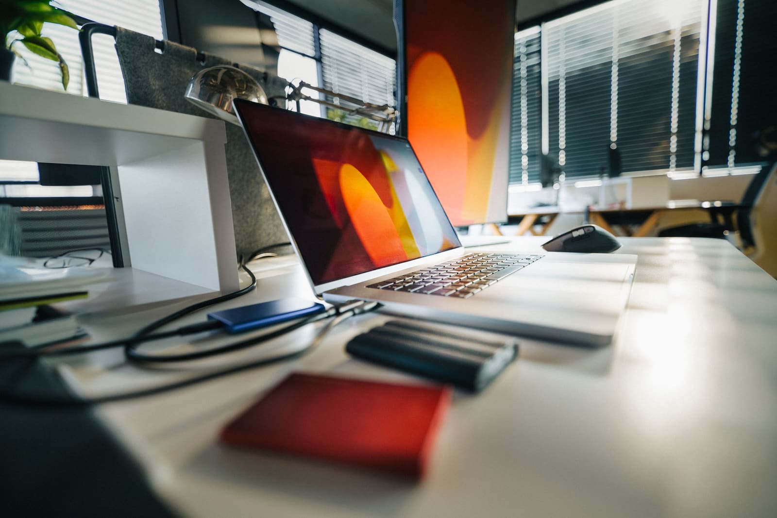 External hard drives connected to a laptop on an office desk
